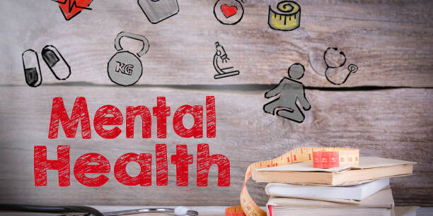 Mental Health. Stack of books and a stethoscope on a wooden background.